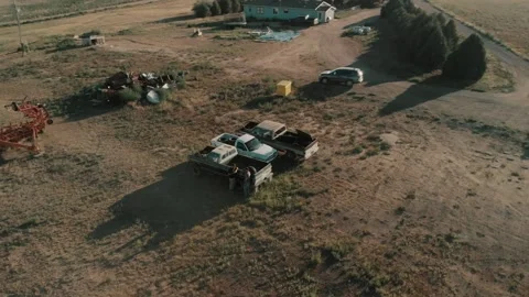 Two Men In a Junk Yard - Drone Flyover Video stock 229906658
