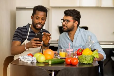 Two men in the kitchen Stock Photos