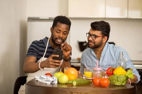 Two men in the kitchen Stock Photos