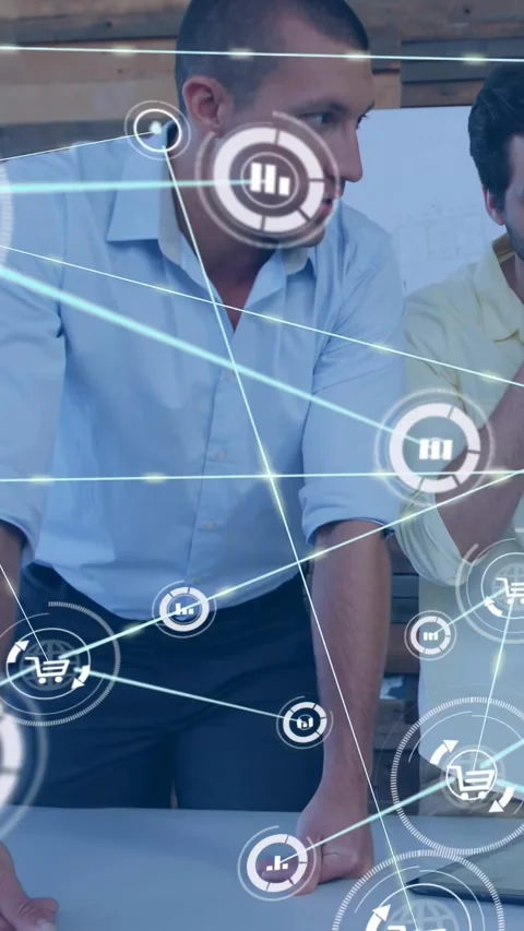 Two men leaning over office table hand bracing camera panning analyzing tablet Stock Footage 332363515
