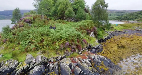 Two men left on a remote island by boat Stockbeeldmateriaal 135485332