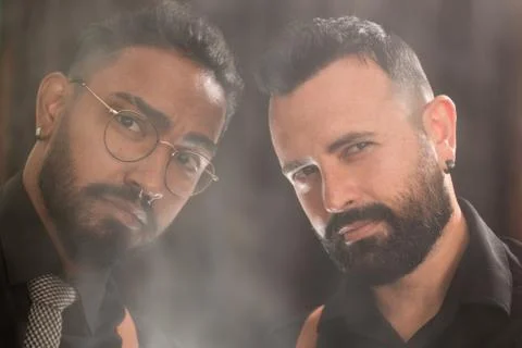 Two men look defiantly on camera. they look like gangsters, hipster style Stock Photos