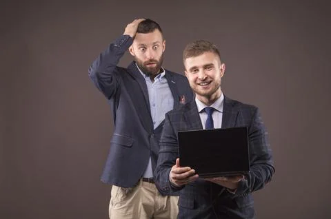 Two men looking at laptop Stock Photos