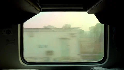 Two Men Looking Out Train Window in India, Friends Traveling on Indian 스톡 동영상 329746290