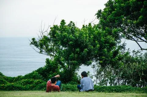 Two men looking at the sea Stock Photos