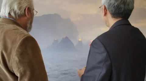 Two men looking at the volcano in the portrait and discusses Stock Footage 36165861