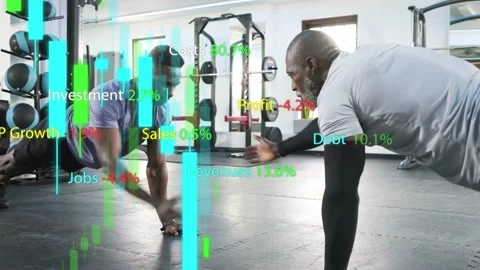 Two men lowering into push-ups and alternating taps in gym, finance charts Vidéo 333803043