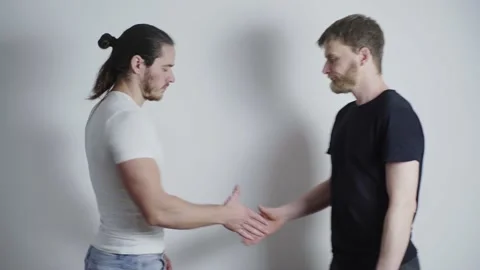 Two men met, shook hands, chatting and smiling Stock Footage 131057276