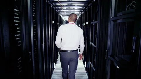 Two men of mixed ethnicity are working in a data centre Stock Footage 67122895