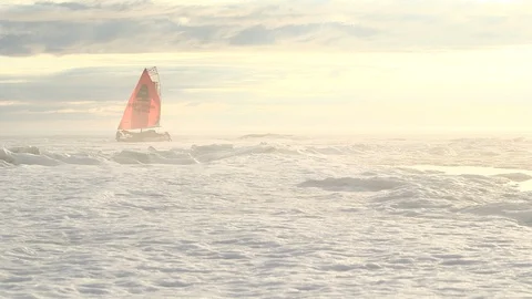 Two men moving a catamaran on the ice floe, North Pole Video stock 104904549