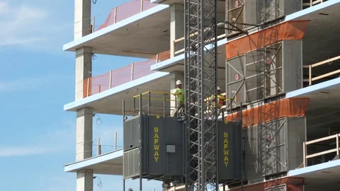 Two men moving up the elevator Stock Footage 80750401