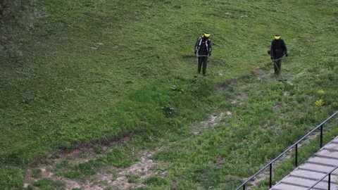 Two men mow grass with trimmers Video stock 135727244