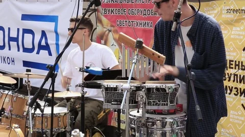 Two men musicians play wind drums in municipal orchestra Stock Footage 108040082
