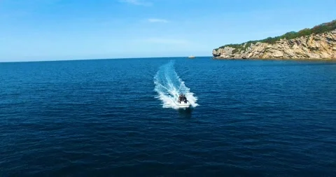 Two Men o a Boat Comes Fastly on the Sea, 4k Drone Shot Stock Footage 149822757