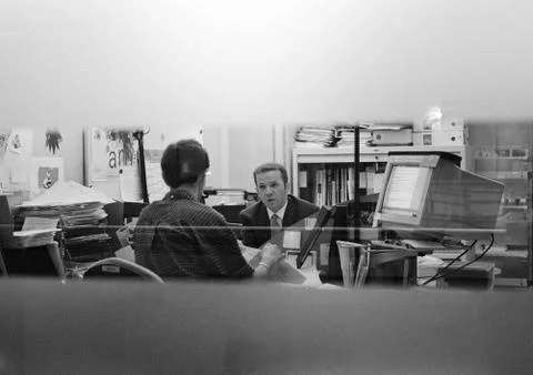 Two men in office, b&amp;w Stock Photos