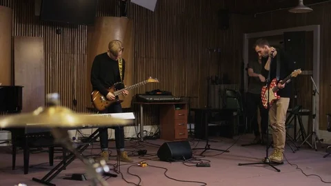 Two Men, One of Them is Playing an Electric Guitar Stock Footage 72207444