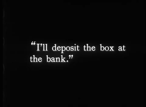 Two men packing mysterious box into bag to take into bank, United Kingdom, 1923 Stock Footage 172219717