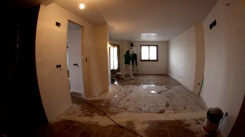 Two men paint the ceiling in the house Stock-Footage 75217097