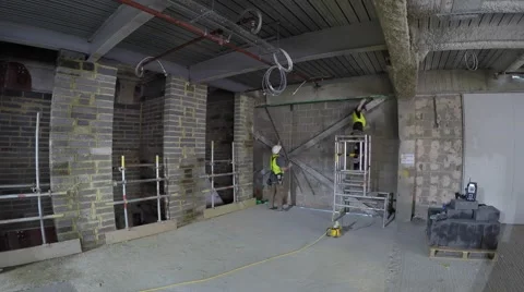 Two men partitioning wall timelapse Stock Footage 66202628