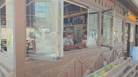Two men play backgammon in a local cafe. Eastern atmosphere. Stock-Footage 123526386