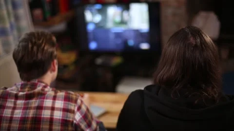Two Men Play Online Video Games Together Stock Footage 56052992