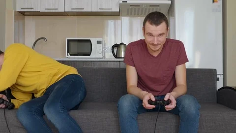 Two men play video game and lose Stock Footage 107651792