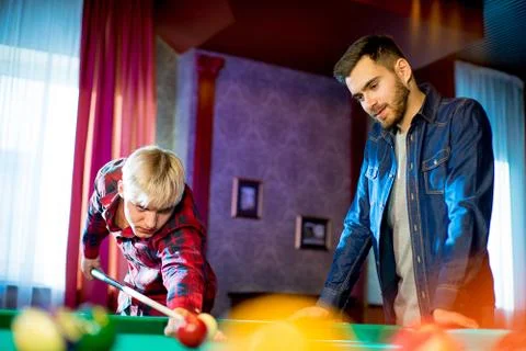 Two men playing billiard Stock Photos