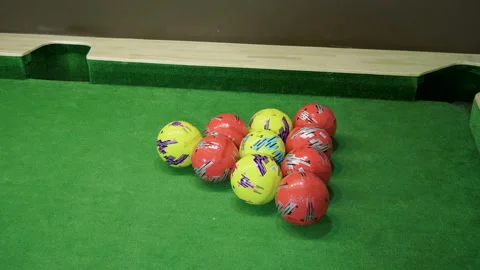 Two men playing billiards, hitting balls into holes on a floor billiard table 4K 库存影片 109270650