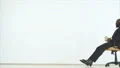 The two men playing with a chair and throwing money. slow motion 4k or 4k+ Resolution