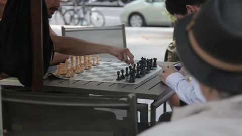 Two Men Playing Chess at an Outdoor Table 스톡 동영상 341323569
