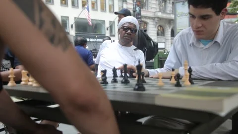 Two Men Playing Chess at an Outdoor Public Table Stock Footage 341323854