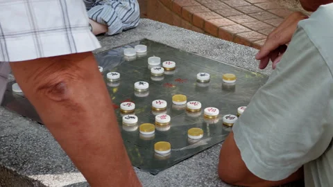 Two men playing Chinese chess Stock Footage 288319455