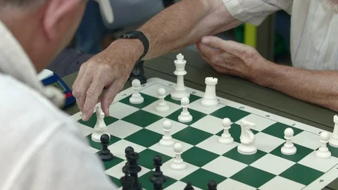 Two men playing a competitive game of chess with a timer Stock-Footage 93519051