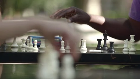 Two men playing a competitive game of chess with a timer Stock Footage 93519161