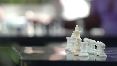 Two men playing a competitive game of chess with a timer Stock-Footage 93519198