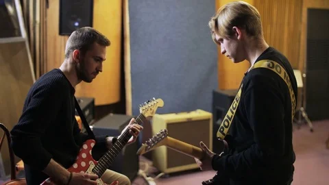 Two Men Playing Electric Guitars Stock Footage 72216204