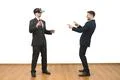 The two men playing game with a virtual reality glasses on the white backgrou Photo