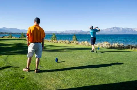 Two men playing golf at Edgewood Tahoe in Stateline, Nevada. Stockfoto's