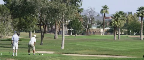 Two men playing golf in the golf course Video stock 103412859