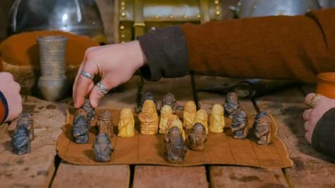 Two men playing popular strategy board game - tafl Stock Photos