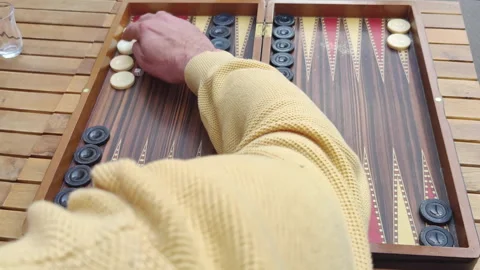 Two Men Playing a Traditional Game of Backgammon Stock Footage 307342400
