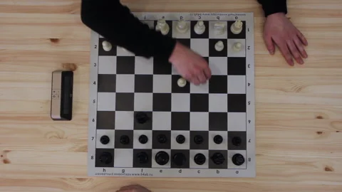 Two men plays in speed chess on wooden table Stock Footage 205312973