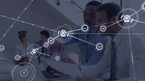 Two men pointing at laptop and paper, laptop input starting growing node overlay Video stock 332625751