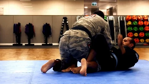 Two men practice Brazilian Jiu-Jitsu sparring Stock Footage 111724895
