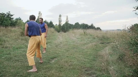 Two men practising free fight on the nature. 4K Stock Footage 80529112