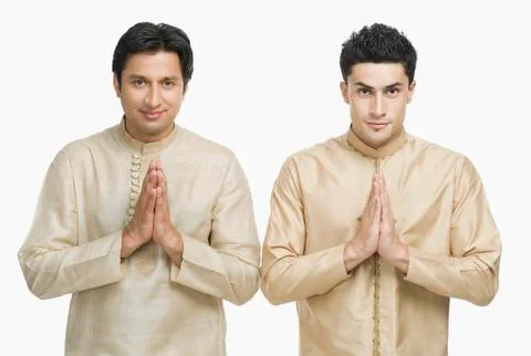 Two men in prayer position Stock Photos