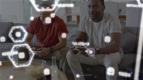 Two men pressing pads starting gaming AR HUD overlaying hexes while right player Stock Footage 333999625