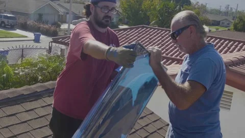 Two Men Pulling Off the Protective Film and Replacing a Skylight Window Stock Footage 212417968