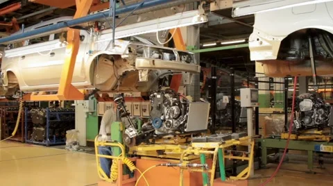 Two men putting engine in car 스톡 동영상 66507639