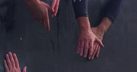 Two men reach to grab another hand but fail Vídeos de archivo 81007483